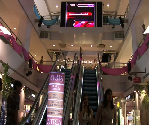 Interior of Atria Mall showing escalators and video screen. Stock Footage 86742443