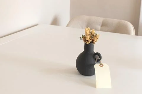Interior background of modern empty room with white wall, black vase with dry Stock Photos