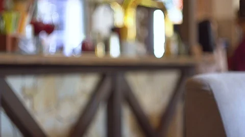 Interior of bar or restaurant in Loft style with wooden decor. Defocused view of Stock Footage 118401336
