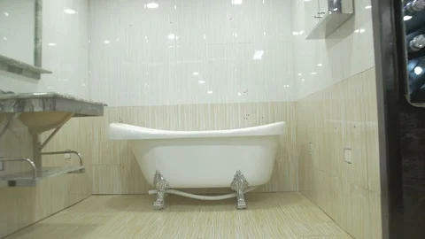 The interior of bath showroom display a single vintage sample bathtub Stock Footage 97563628