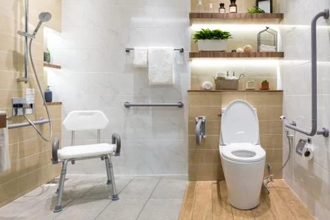 Interior of bathroom for the disabled or elderly people. Handrail for disable Stock Photos