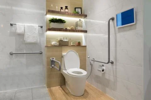 Interior of bathroom for the disabled or elderly people. Handrail for disable Stock Photos
