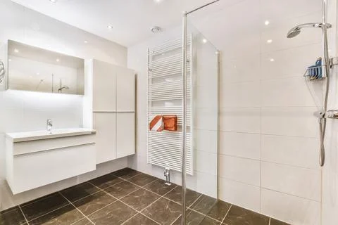 Interior of bathroom with shower and sink Stock Photos