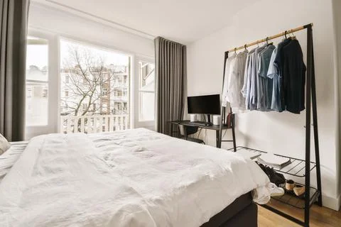 Interior of bedroom with clothes Stock Photos