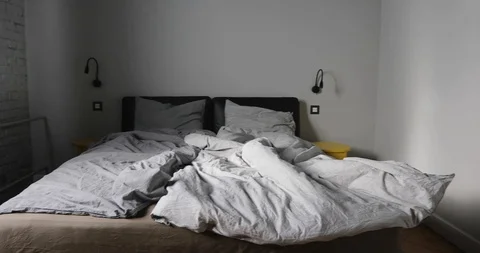 Interior of bedroom with unmade bed Stock Footage 87812731