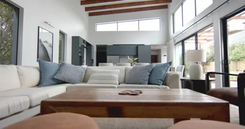 Interior of bright open plan living room, dining room and kitchen, copy space, Stock Footage 255700173