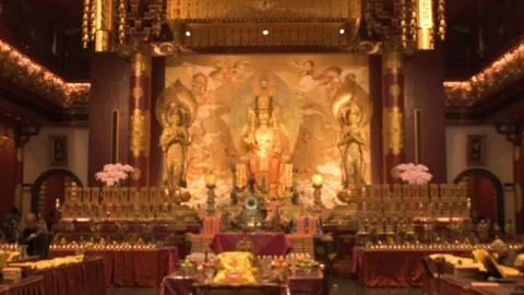 Interior of Buddha Tooth Relic Temple Shrine in Singapore With Worshippers Stock Footage 109536917