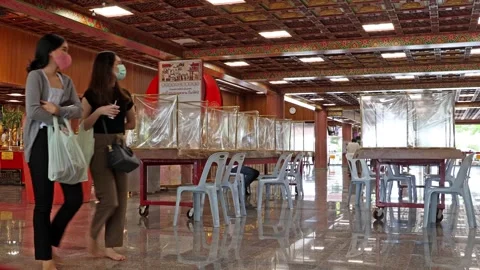 The interior of the Buddhist temple with tables adapted to for social distance Stock Footage 240217021