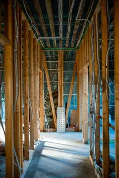 Interior of Building Under Construction with Exposed Wooden Framing Stockfoto's