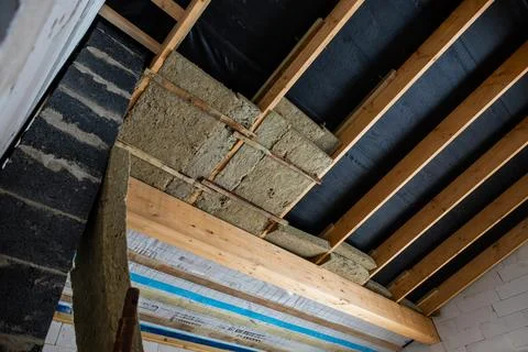 Interior of Building Under Construction with Exposed Wooden Beams Foto stock