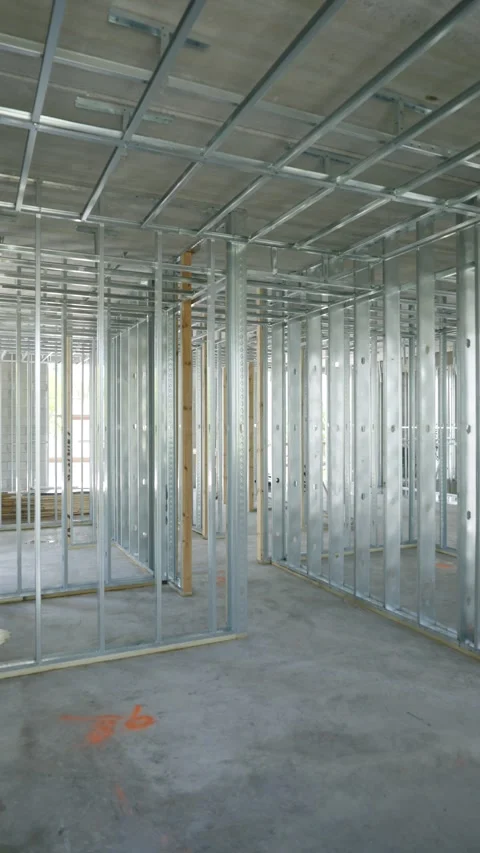 Interior of building under construction focusing on house framing. Metal studs Stock Footage 293849726