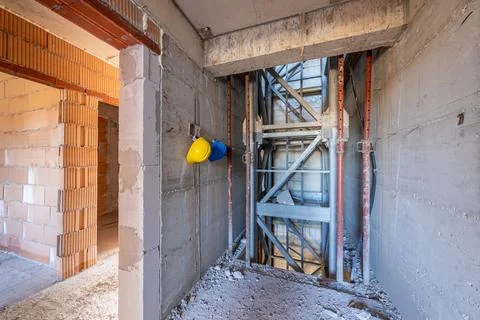 Interior of a building under construction. Unfinished elevator shaft, raw c.. Stock Photos