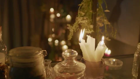 Interior with Burning Candles and Dried Herbs in Fortune Tellers Room Stock Footage 247640201