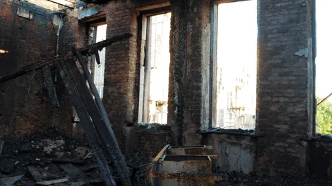 Interior of burnt by fire building, burned furniture, disaster, ruins and Stock Footage 90223935