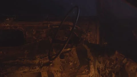 Interior of a burnt out burning car after an accident. Stock Footage 234974748