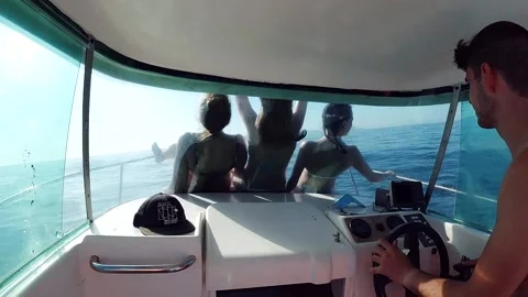 Interior of the cabin of a sailboat with the driver and a group of tourists Stock Footage 135020760