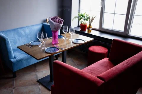 Interior of cafe, empty armchairs stand in a restaurant against the background Stock Photos