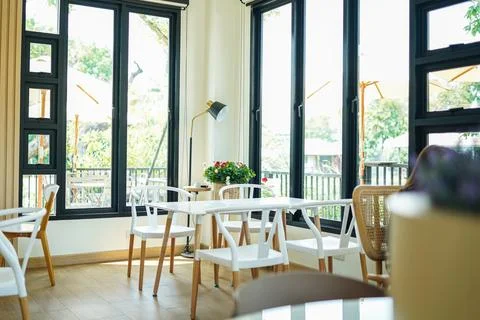 Interior of cafe restaurant slective focus table and chairs Stock Photos