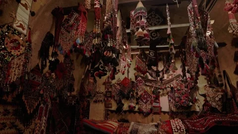Interior capturing a vibrant display of handcrafted Persian carpets, woven Stock Footage 347276565