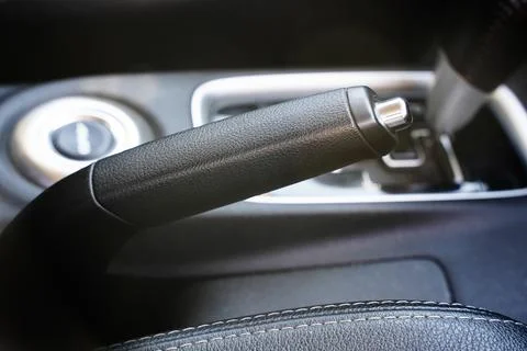 Interior car elements, close-up of handbrake, buttom for stopping auto Foto stock