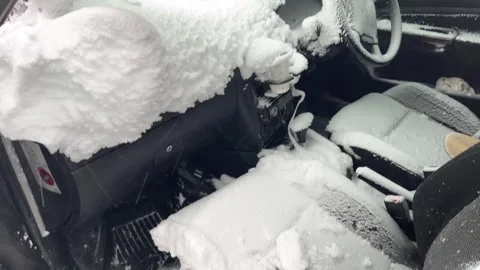 Interior of car filled with fresh white snow after winter blizzard Stock Footage 319555345
