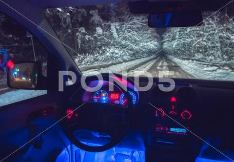 The interior of the car on the forest road. evening night time Stock Photos