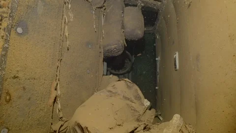Interior of car lying inside cramped hold of ferry Salem Express shipwreck, Slow Stock Footage 243180119