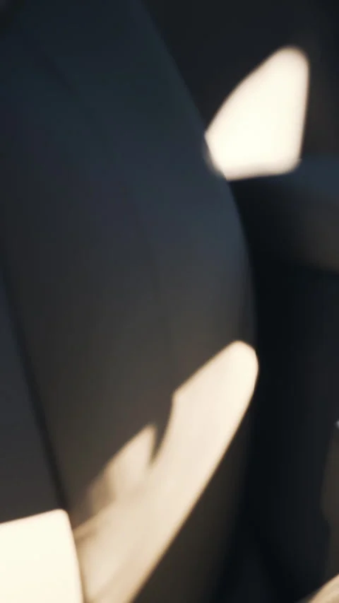 Interior of a car showing seats and seatbelt during a sunny day Stock Footage 337970174