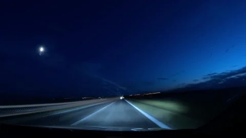 Interior car view showing fast moving light trails on night roads recorded .. Stock Footage 314110252
