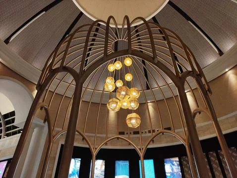 Interior ceiling design with bright yellow lamps and arches Stock Photos