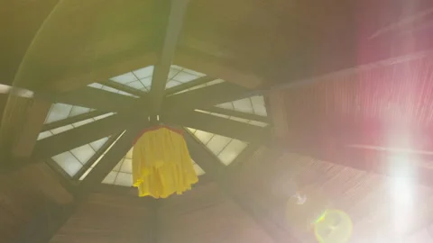 The Interior Ceiling of an Empty Buddhist Temple as the Sun Rays Shine Through Stockbeeldmateriaal 208754423
