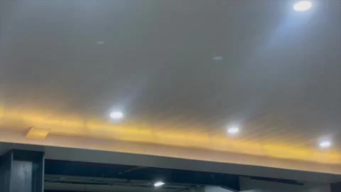 Interior ceiling lighting with white downlights and warm yellow hidden led. Видео 334324791