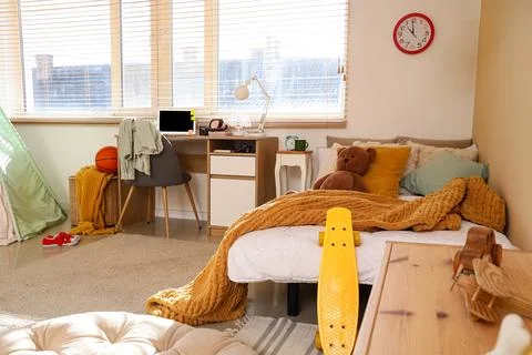 Interior of children's room with study table, bed and toys Stock Photos