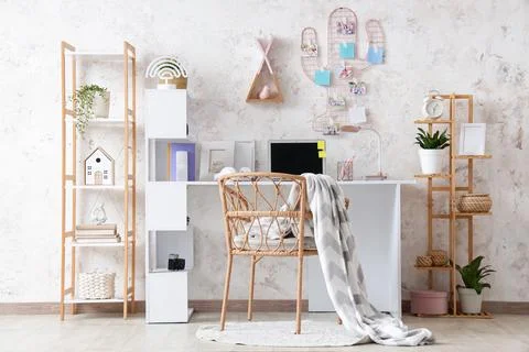 Interior of children's room with study table, pin board and shelves Stock Photos