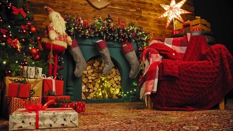 Interior christmas. magic glowing tree, fireplace gifts in dark at night. 4K Stock Footage 98683423