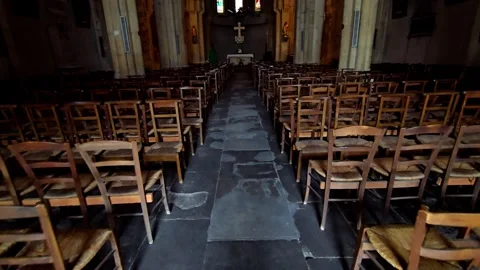 Interior of a church with sunlight casting spots on empty benches, recorded.. Stock Footage 316811289