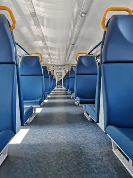 Interior coach commuter train. Train car inside. Absence of travelers passeng Stock Photos
