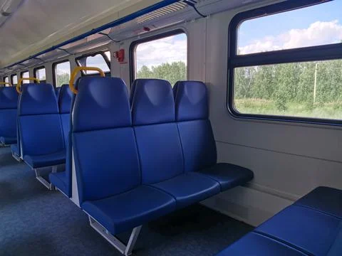 Interior coach commuter train. Train car inside. Absence of travelers passeng Stock Photos