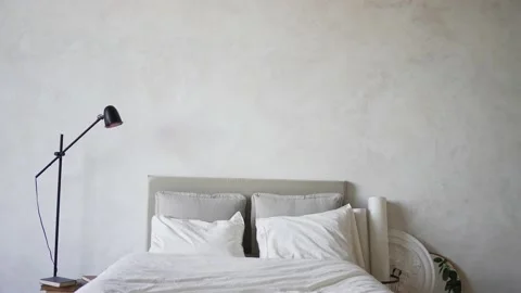 The interior of a comfortable studio. Bed in gray apartments without people Stock Footage 156600676
