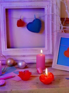 Interior composition of balls, lit candles, wooden frames, decorative lamps Stock Photos