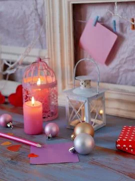 Interior composition of balls, lit candles, wooden frames, decorative lamps Stock Photos