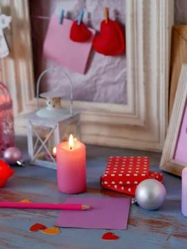 Interior composition of balls, lit candles, wooden frames, decorative lamps Stock Photos