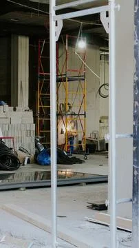 Interior construction site with scaffolding and building materials Stock Photos