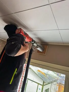 Interior construction work drilling hole through wooden structure for insta.. Stock Photos