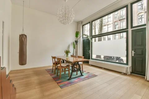 Interior of contemporary light dining room with fur decorative elements 스톡 사진
