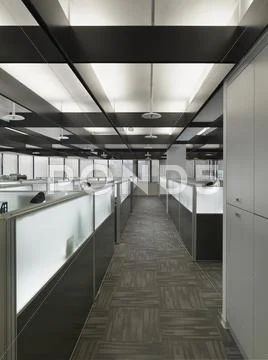 Interior of a contemporary office space with cubicles Stock Photos