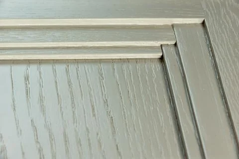 Interior corner of a textured white kitchen facade. Paint texture background  Stock Photos