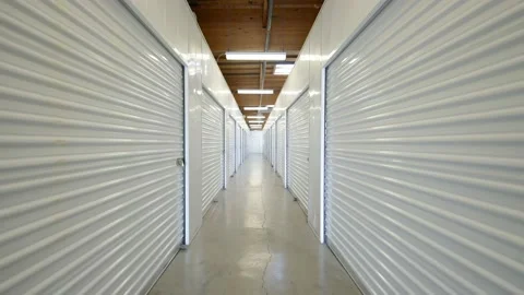 Interior of corridor self storage units at storage facility with locked doors Stock Footage 204831126