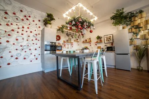 Interior of a cozy modern spacious kitchen for a large family, decorated for the 스톡 사진