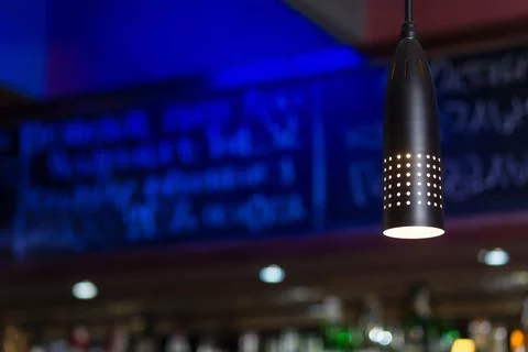 Interior of cozy pub or coffee shop or cafe with bottles of spirits on shelve Stockfoto's